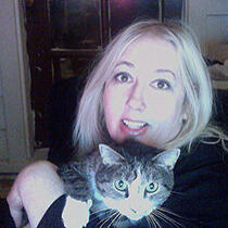 Photo of artist Desi Lucia with one of her beloved kitties.